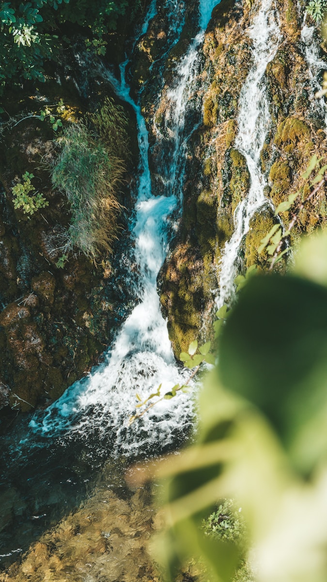 a view of a small waterfall from above